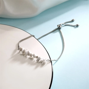 Detailed shot of white crushed stone bracelet with adjustable silver sliding clasp