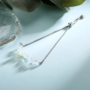 Detail of stainless steel bracelet with natural white stones and adjustable slide clasp