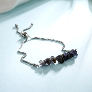Detail of adjustable silver box chain with irregular dark purple and grey raw stone pieces