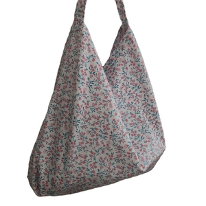 Floral cotton shoulder bag with pink blossom patterns and a relaxed hobo tote silhouette