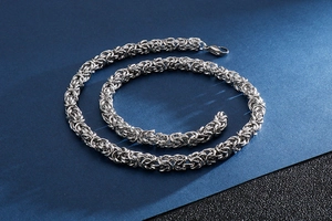 Detailed close-up of a silver stainless steel keel chain with lobster clasp for men
