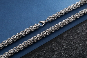 Macro shot of silver stainless steel keeled chain necklace with secure lobster clasp
