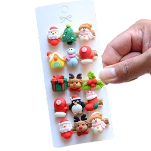Christmas hair clips set with reindeer and Santa motifs on white card display