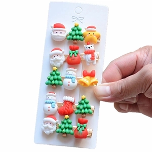 Christmas hair clips set featuring Santa, reindeer and tree on white display card