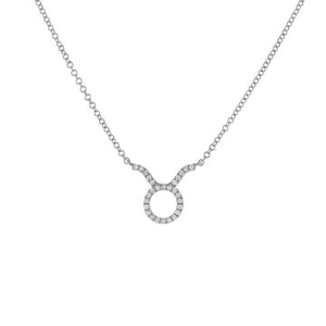 Macro detail of silver Taurus zodiac pendant with sparkling zircon stones on a fine chain