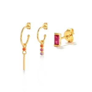 Detail of gold ear cuff set featuring vibrant red and purple zircon stone inlay