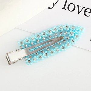 Blue flower hair clip with sparkling rhinestones and pearls on a silver metal base