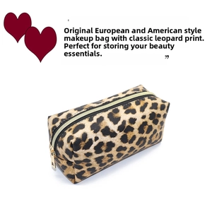 Close-up of leopard print makeup bag featuring a premium gold metal zipper closure