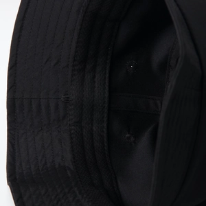 Close-up of internal stitching and high-quality fabric texture on the black bucket hat