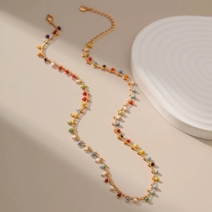 Exotic 18K gold-plated copper necklace featuring vibrant colorful beads on a gold chain