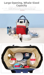 Top-down macro view of large capacity diaper bag showing organized multi-pocket interior