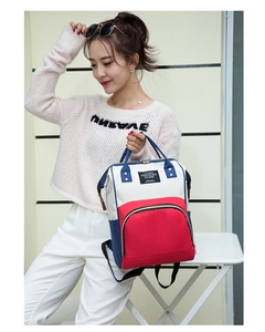 Detailed side view of the tricolor nylon diaper bag with large red zipper pocket
