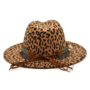 Detail of leopard print wool fedora featuring ethnic braided bands and tassel charms
