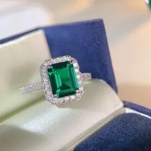Elegant S925 silver ring featuring a 3ct emerald cut green stone with halo setting