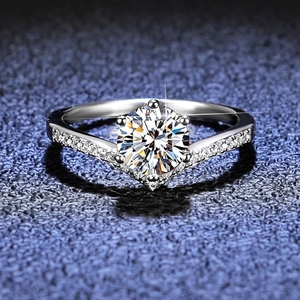 Macro detail of high-quality round cut moissanite diamond ring in V-shaped band