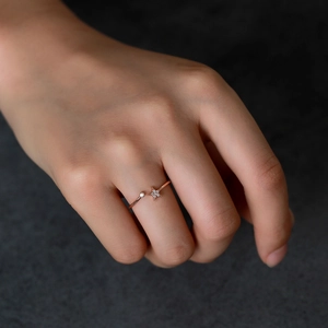 Elegant rose gold star open ring with sparkling zircon stones on a model hand