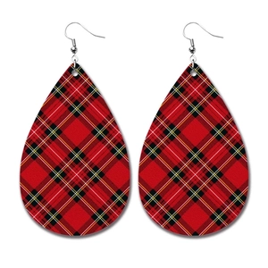 Detail of red and black buffalo plaid teardrop faux leather earrings with silver hooks