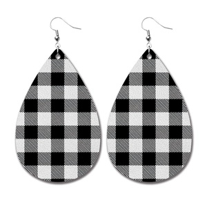 Detailed view of teardrop PU leather earrings featuring classic black and white buffalo plaid