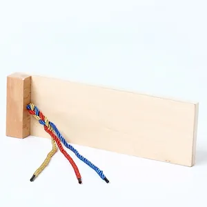 Montessori wooden braiding board for toddlers featuring red blue and yellow cords