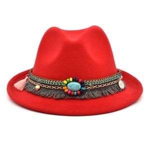 Detail of red wool fedora with bohemian beaded band and turquoise coin accents