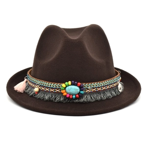 Detail of dark brown wool fedora with bohemian woven band and turquoise bead accents