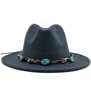 Detailed view of dark wool fedora hat featuring a turquoise beaded bohemian band