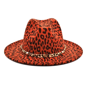 Detailed view of leopard print fedora hat with gold star buckle and textured wool felt