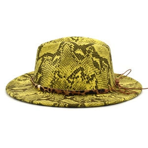 Detail of yellow fedora with snake print, leopard band, and gold star pendant