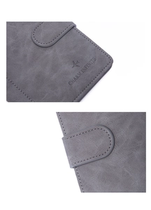 Detail of gray leather passport wallet showing snap closure and Charm Infinite logo