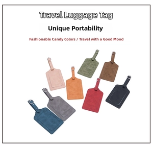 Detailed view of eight colorful leather luggage tags with adjustable metal buckles and straps