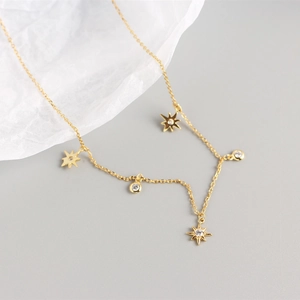 Detailed close-up of S925 silver star necklace with round cubic zirconia pendant on thin chain