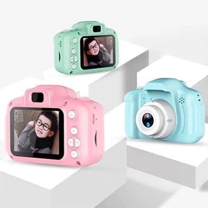 Kids digital cameras in mint green, pink, and light blue on white geometric stands