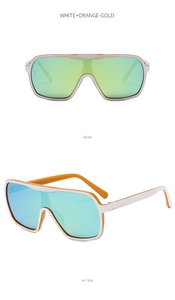 Detail view of white and orange-gold oversized wrap sunglasses with gradient lens