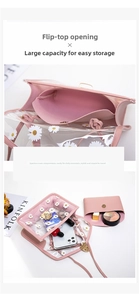 Detail view showing spacious interior of pink daisy transparent PVC crossbody jelly bag