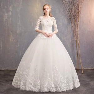 Elegant white lace ball gown wedding dress with off-shoulder neckline and half sleeves