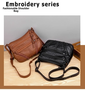 Detail view of large capacity crossbody bags with litchi texture and woven trim