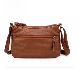 Rear view of brown litchi pattern faux leather crossbody bag with functional zipper pocket