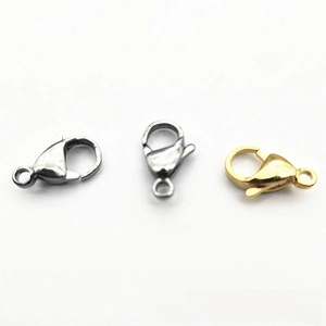 Detailed view of gold and steel lobster clasps for DIY jewelry making and necklaces