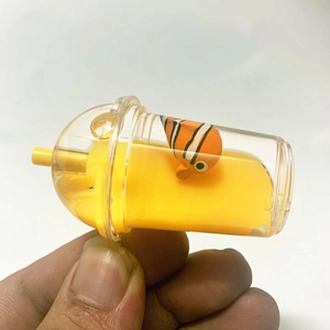 Detail of acrylic milk tea cup keychain with floating clownfish and yellow liquid