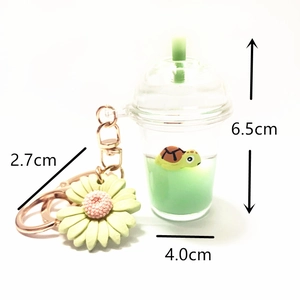 Detailed dimensions of the acrylic keychain showing turtle bottle and sunflower charm