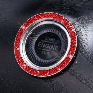 Macro shot of luxury red crystal rhinestone engine start stop button trim cover