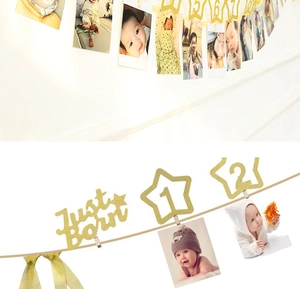 Detail von goldenen Glitzer-Stern-Fotorahmen für den ersten Baby-Geburtstag Banner