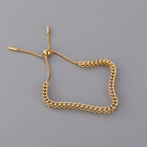 Adjustable golden woven Cuban chain bracelet with sleek slider clasp and metal charms