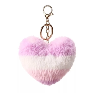 Detailed view of fluffy heart-shaped faux fur keychain with pink and purple gradient stripes