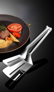 Macro shot of 304 stainless steel food tongs with hollow head for oil drainage