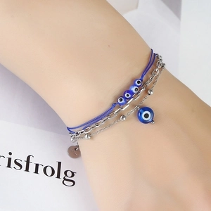 Bohemian multi-layer evil eye bracelet with blue woven rope and silver beads