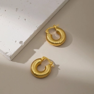 18K gold plated copper earrings with ribbed texture and solid hoop design for women