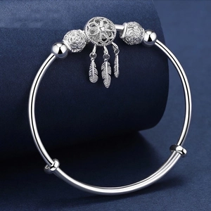 Adjustable dreamcatcher silver bracelet with hollow beads and feather pendant