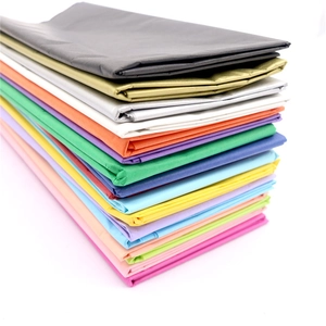 Colorful waterproof tissue paper stack showing various vibrant colors on a white background