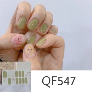 Detail of QF547 floral nail stickers with green matte and pink smiley daisy patterns